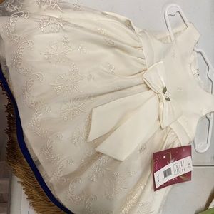 Ivory dress by Princess Faith with fringes. Brand new!